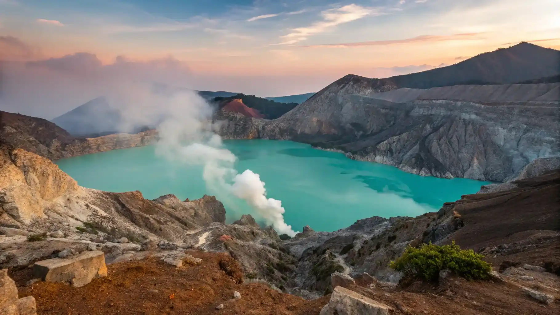 The Kawah Ijen crater, acid lake and sulfur vents under early morning light